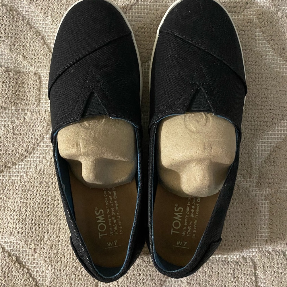 Never worn Toms!